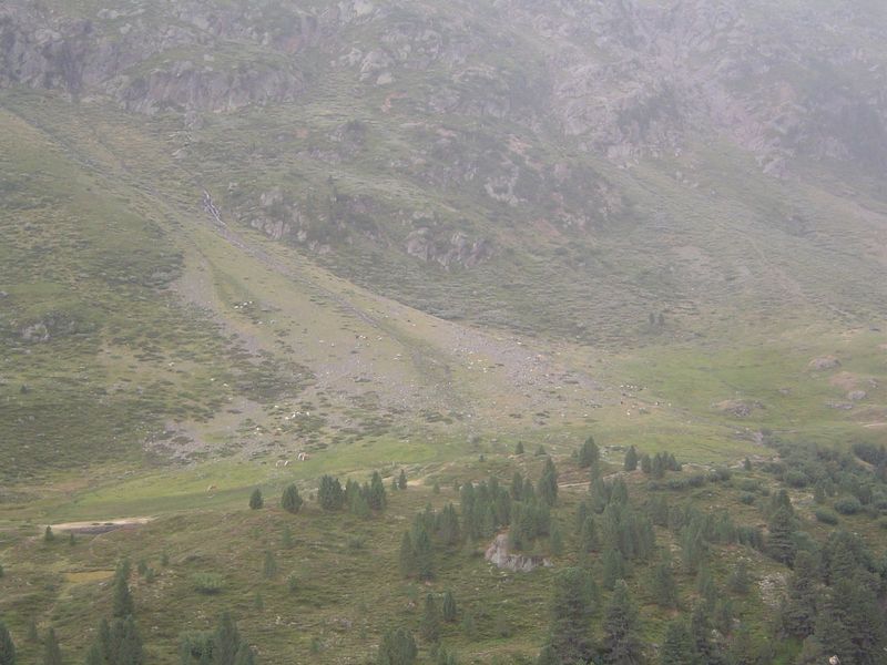 Now we're climbing. Living up here means learning to live with landslides.