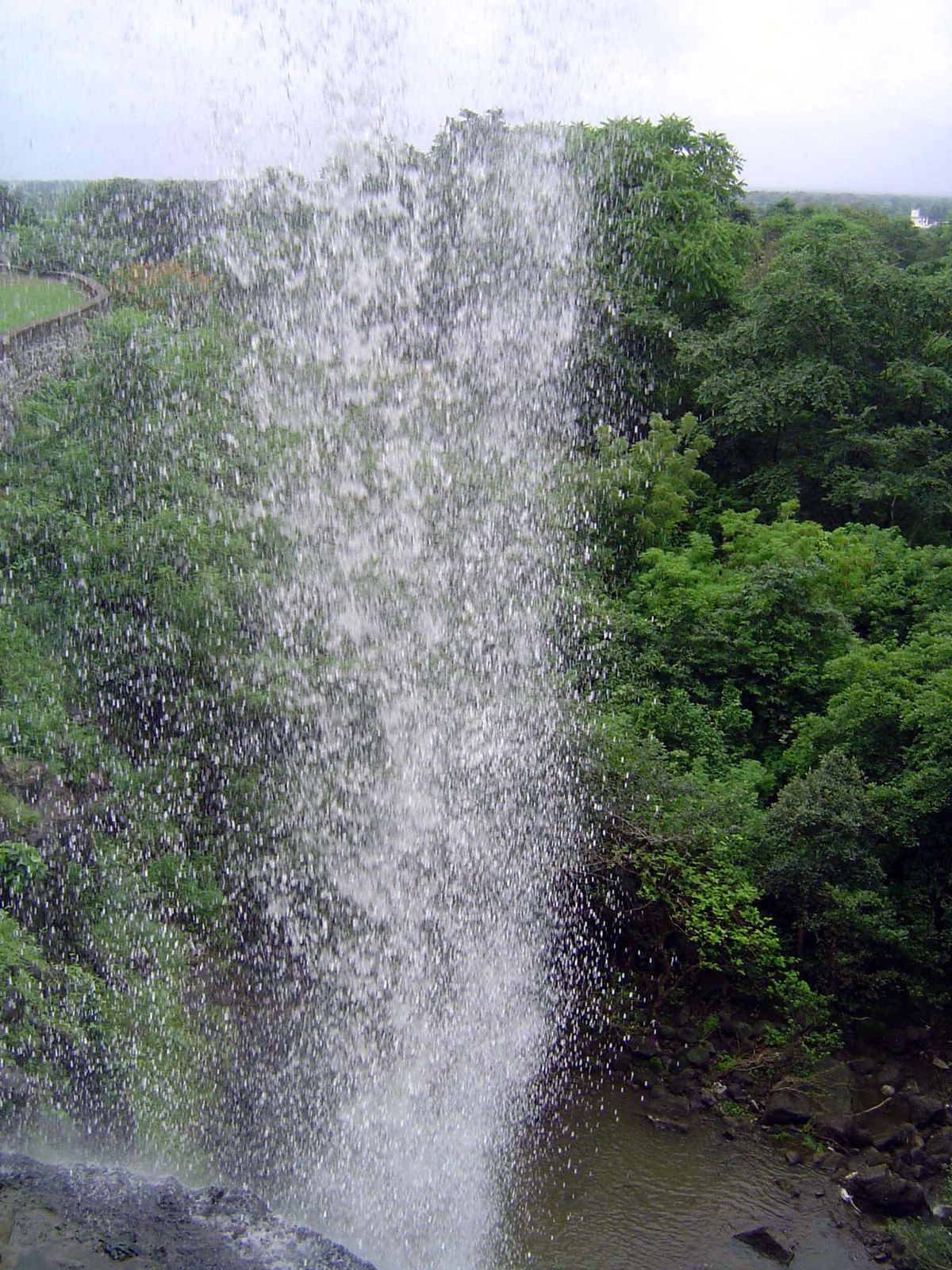 The view of the same waterfall from the mouth of the cave behind it.