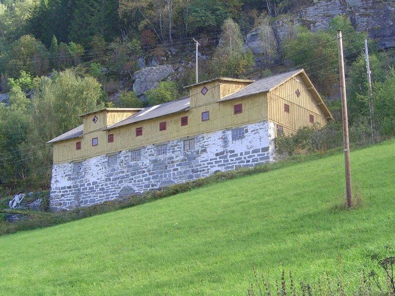 The road whizzes past old barns that remember when travel was harder.