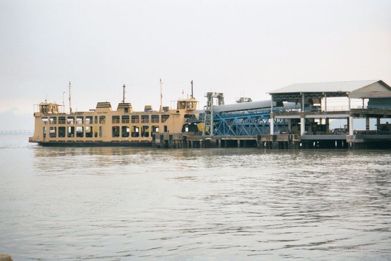 Automobile ferries to the mainland limp along, crippled by a bridge opened in 1988.