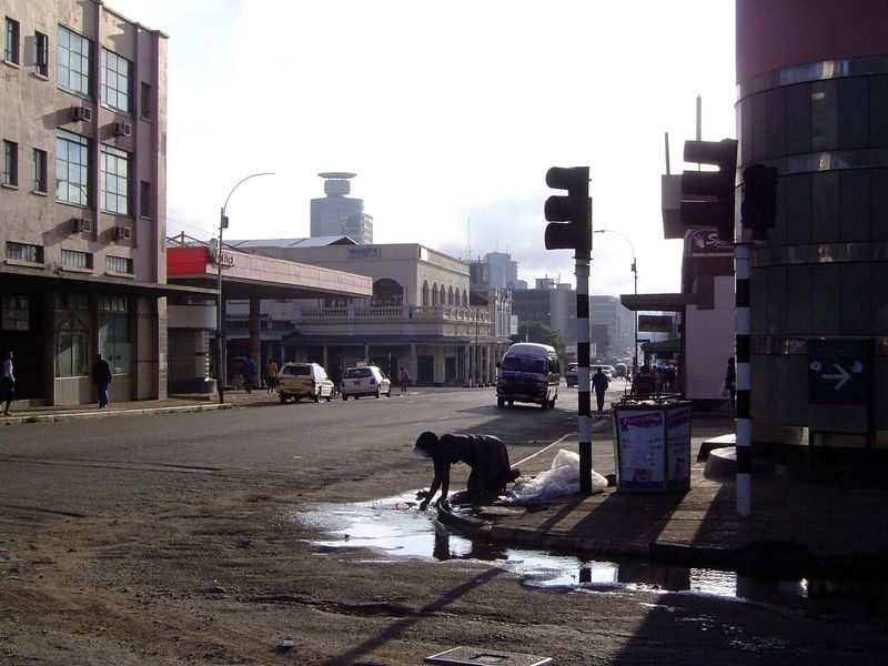 Washing in a gutter.
