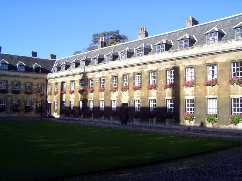 The chapel is behind us. These buildings are older than they look. Peel away the ashlar facing, applied in 1754, and there's a building from