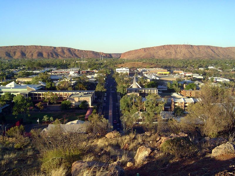The mountains are transected by the Heavitree Gap, named for a village in Devon that had been the home of one of the surveyors of the Overla