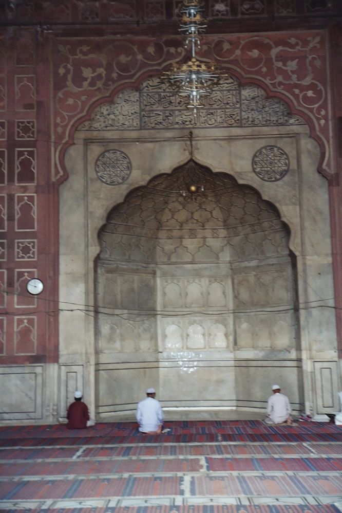 The central mihrab, or niche, marks the direction of Mecca; so, for that matter, does the wall, which defines the qibla, or axis of prayer. 