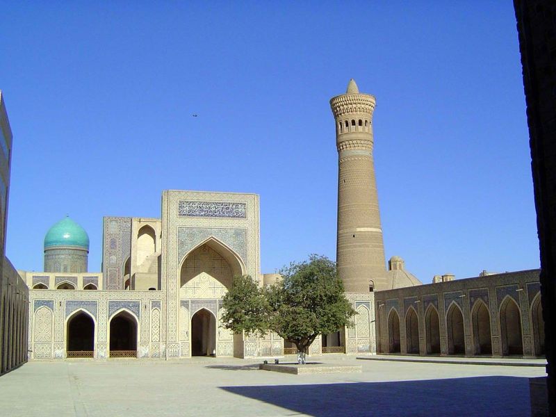 The madrasa and minaret, seen from the mosque.