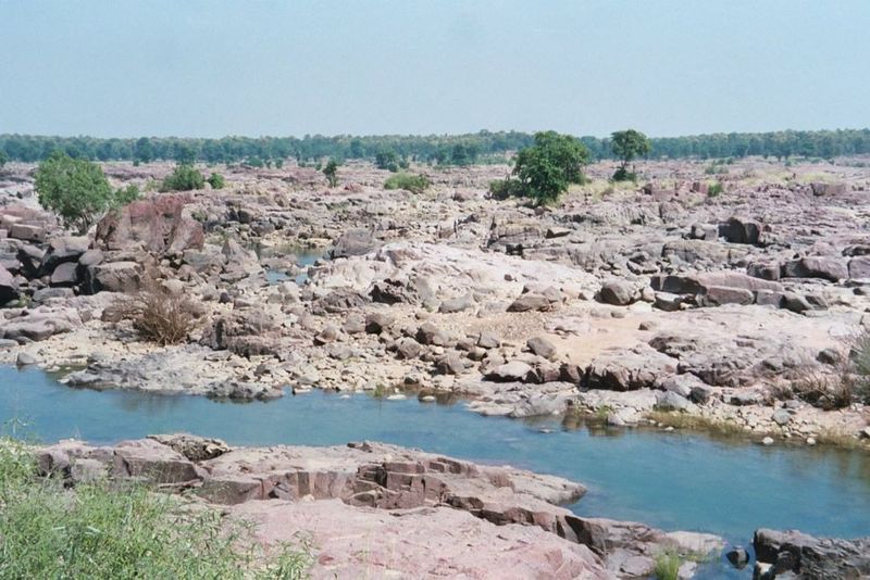 Then the forest opens to reveal a huge expanse of rock scoured bare by historic monsoon floods.