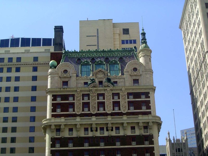 The hotel is still in business, though with far fewer rooms than in its heyday. The architectural trimming is in keeping with the overloaded