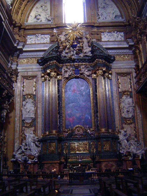 The left transept has the Chapel of St. Ignatius. Blunt writes, "In 1696 the whole altar was replaced by a new one designed by Andrea Pozzo,