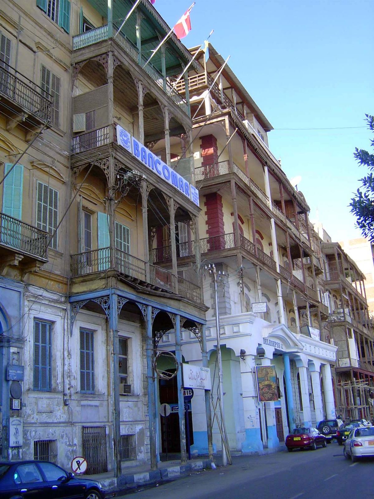 The waterfront is lined with colonial-era buildings in an advanced state of decay. Once there were German, British, French, Austrian, Italia