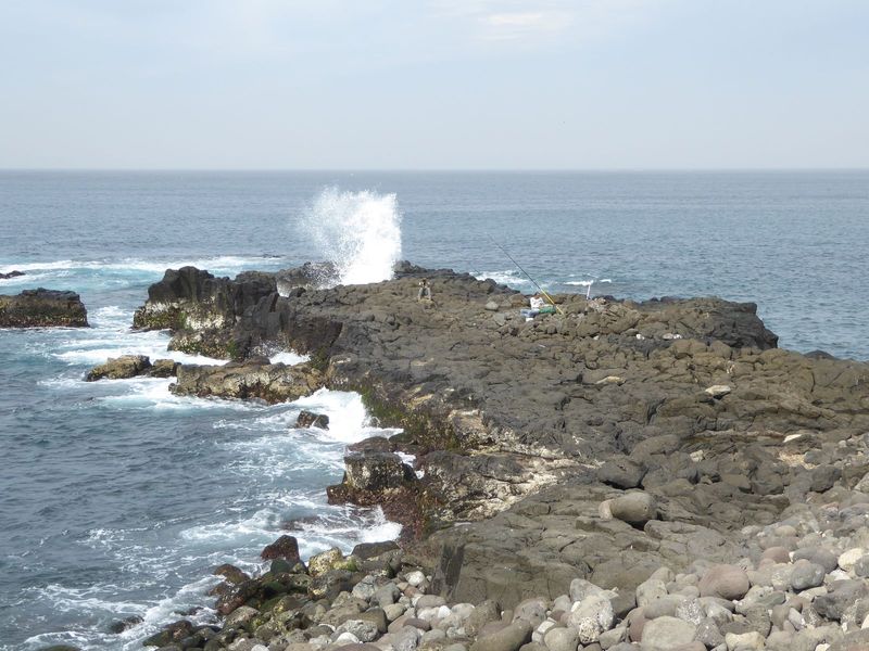 The coast isn't always so easy to use, and three miles farther up the coast, some fishermen are truly determined. Walking out there isn't as