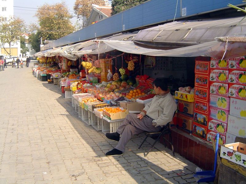 A fruit market, noteworthy not only for its color but its quality.