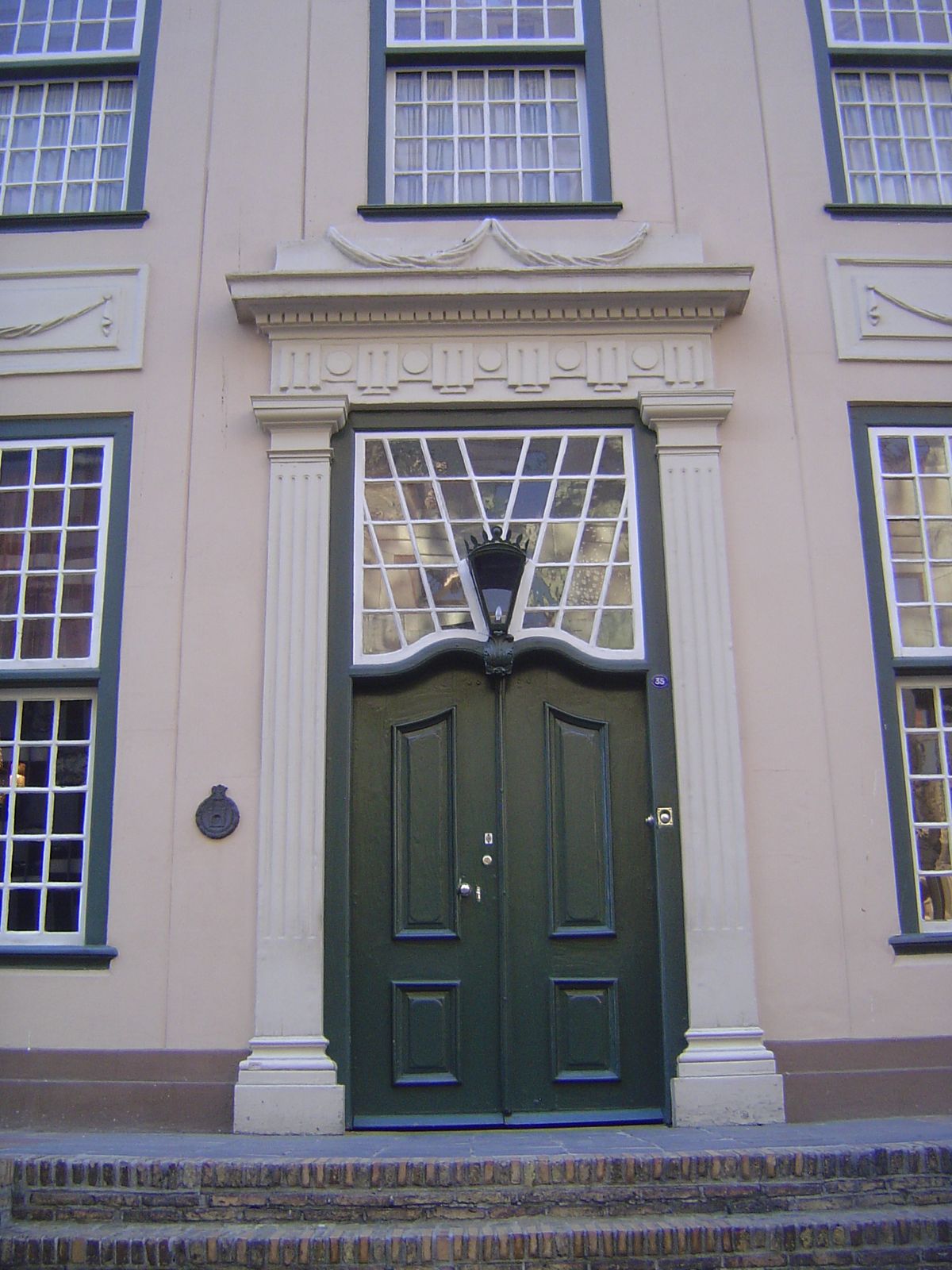 This fanlight-to-die-for is from just before 1800. Pity the window washer.