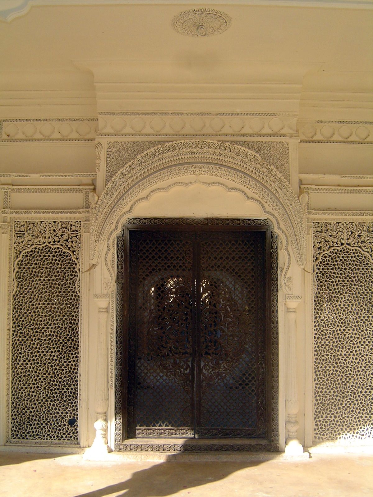 Looking east to plaster and wood jalis.