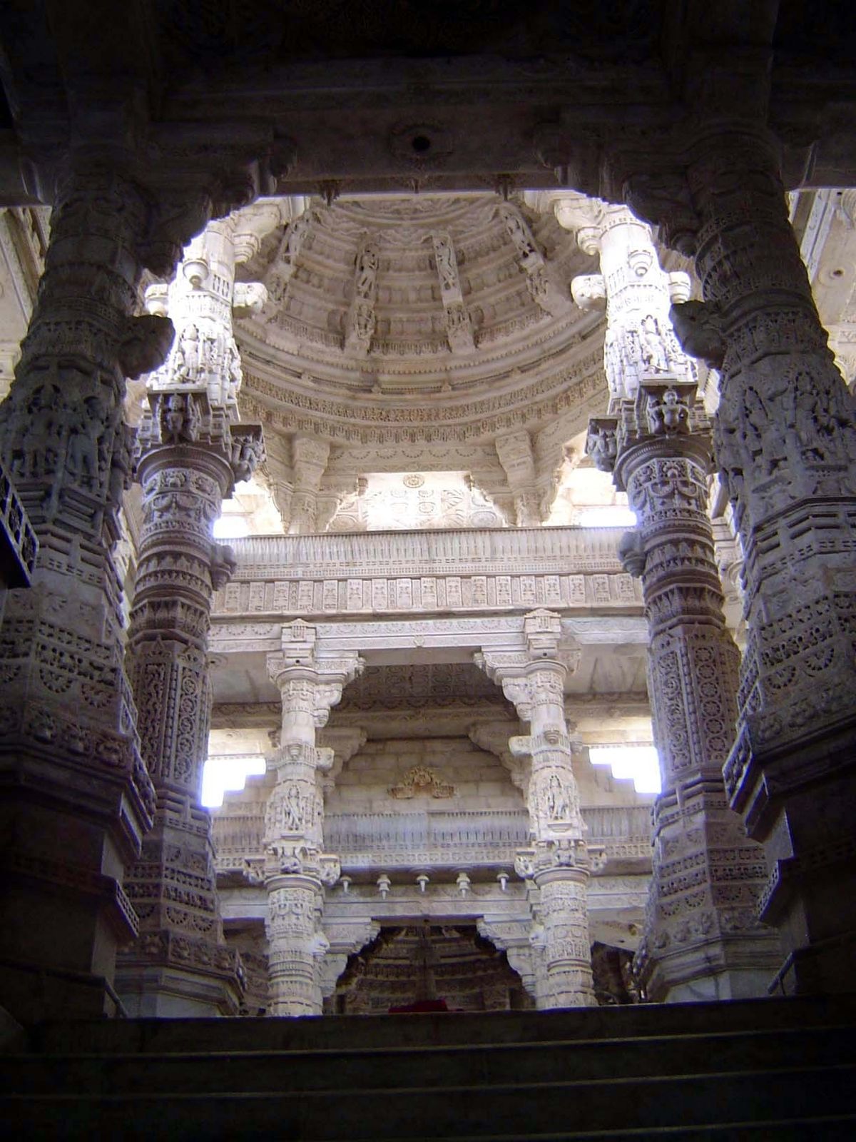 Between the entrance and the central shrine is a mandapa or columned hall with, in this case, three levels. The dome is false—corbelled—not 