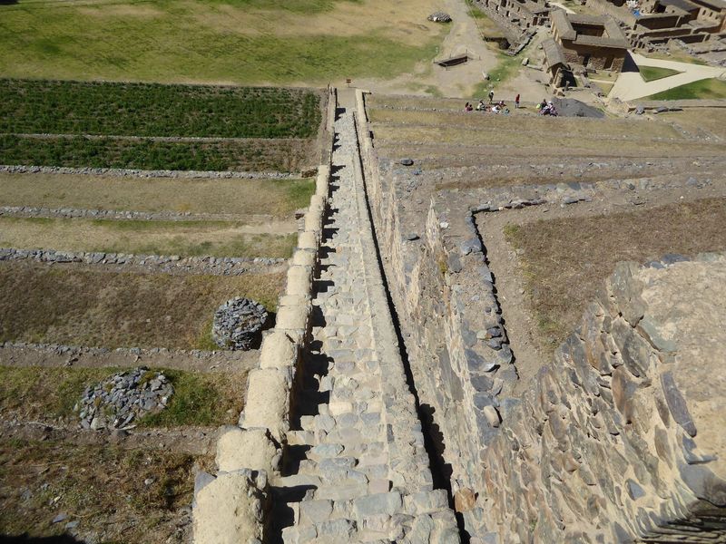 We're up top of this second set of terraces and looking down not only a staircase but an irrigation channel.