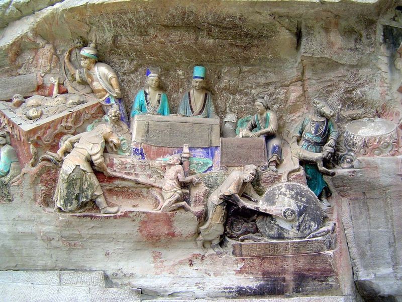Ten kings of hell, with an assistant at their sides, consign victims to any of ten dreadful fates. Three appear here. On the left is the Hel