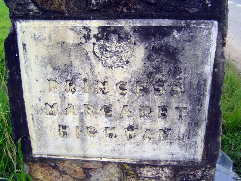 Lost in traffic: a marker at the start of the highway south from Port of Spain to San Fernando. Despite the sign, the highway is popularly c