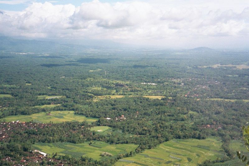 From the summit looking straight to Borobudur, which is in the center of the image.