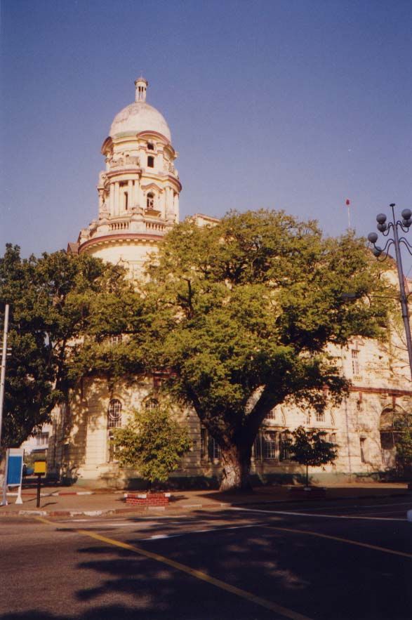 We'll just walk along the Strand, starting at this former post office, a nice Edwardian relic. Today it houses Branch Three of the Myanmar E