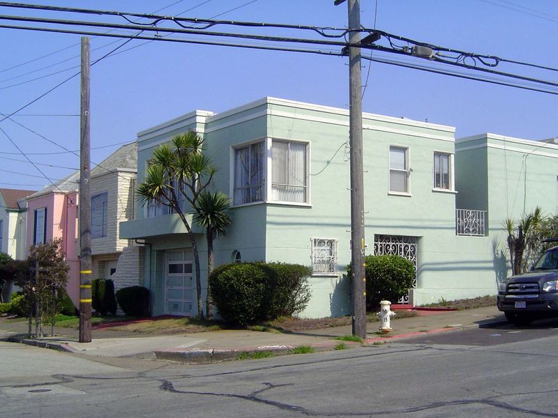 Styles ran from pseudo-Spanish to budget Moderne. Underneath, the framing was redwood.