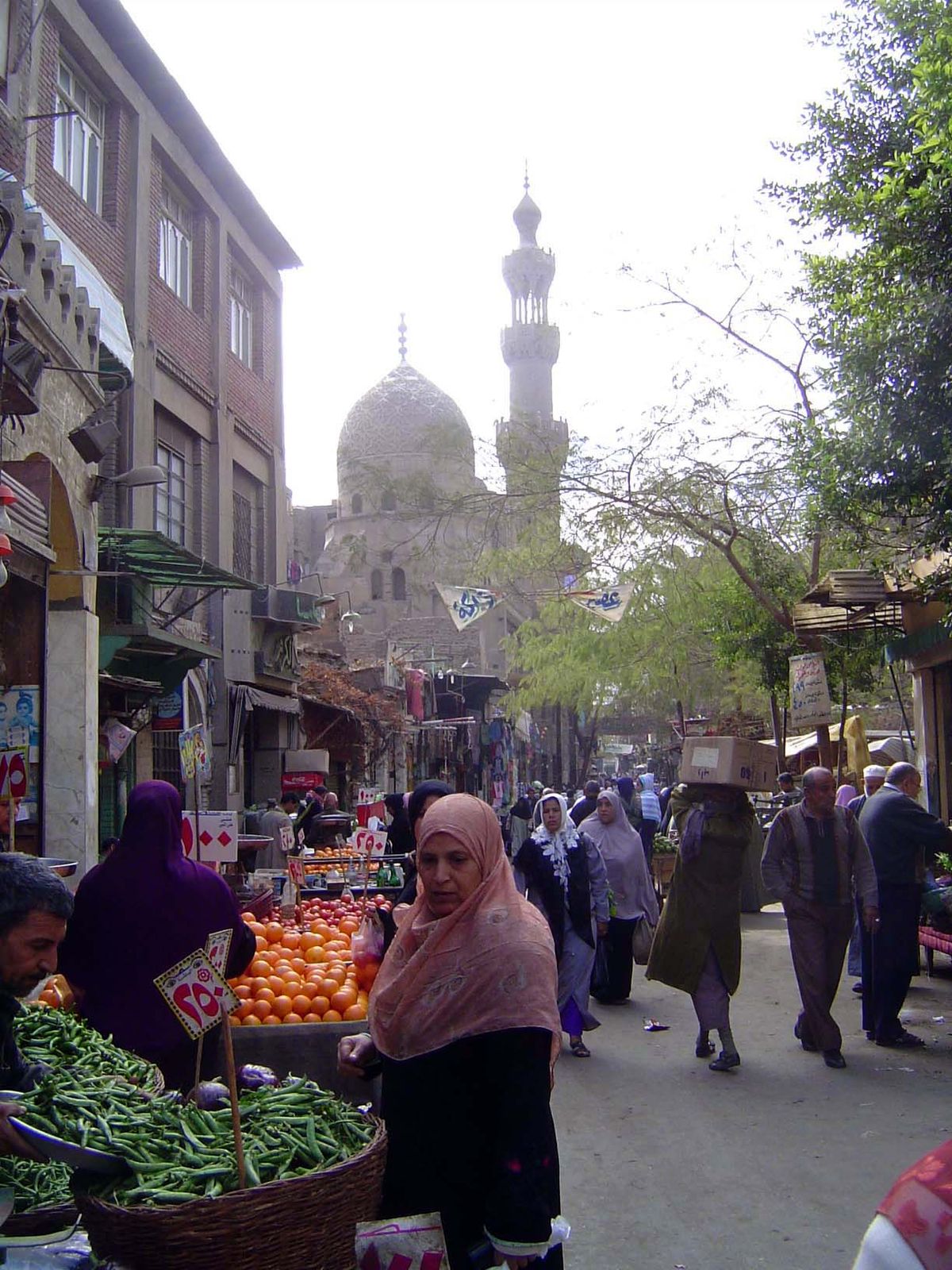 No. 129 The workday begins. In the distance is the Mosque of Ganem al-Bahlawan, built 1478-1510. Al-Bahlawan was a brother of the chief amir