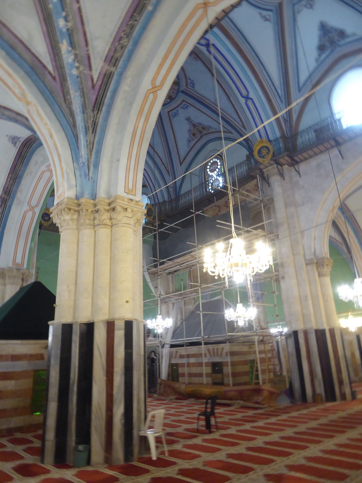 Tankiz also added the bands of colored marble to the church. How old is the ceiling paint job? Good question.