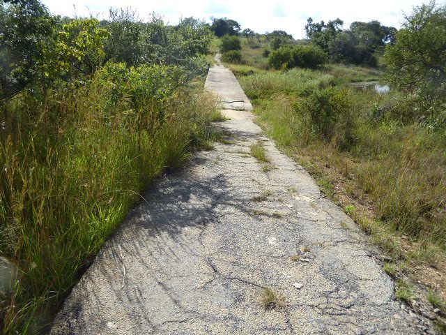 This, along with strip roads, is what once made driving in Africa fun. It's assumed that you're a big boy and don't need guard rails. Just d