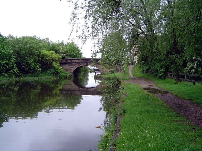 From time to time, an old bridge crosses the canal.