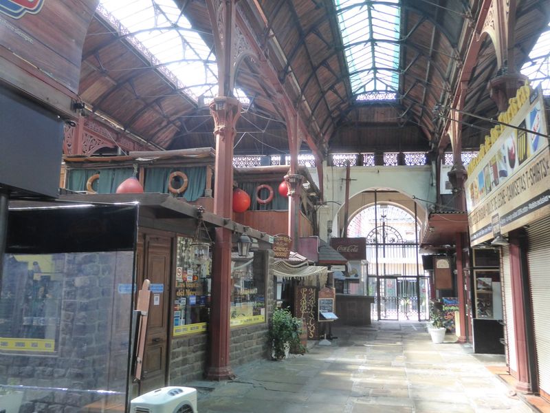 No flies buzzing, no handcarts bumping, but the ironwork's nice. The life preservers and floats give the tourist game away.