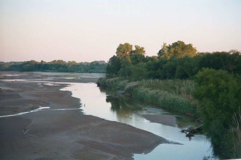 In summer, the water is very warm. Twenty miles downstream from this spot, white homesteaders in 1889 came splashing across the river to sta