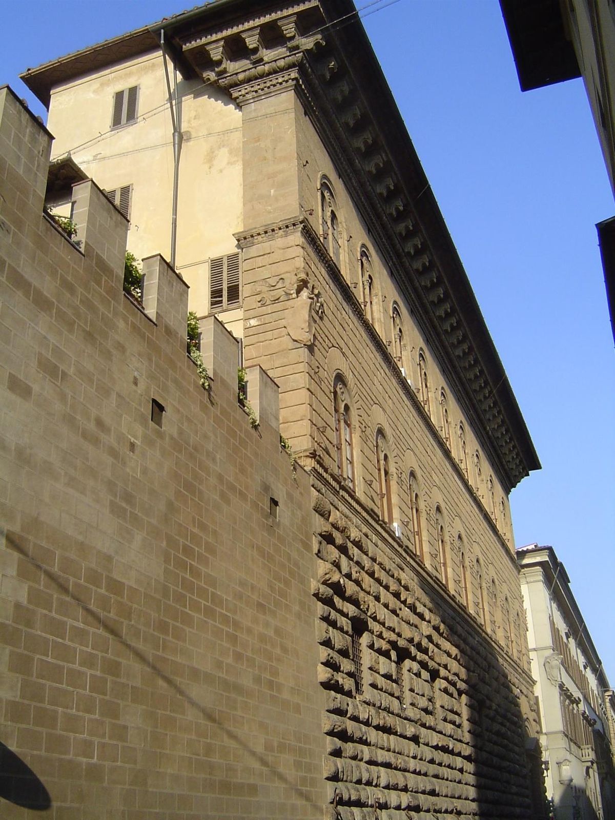 The addition is seen here from around the corner, where it appears almost as an elaborate false front abutting an open but walled courtyard.