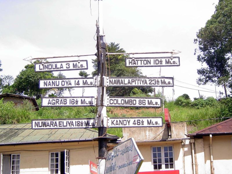 A few miles farther along the line, old road signs give directions at Talawakele; very few signs of this vintage survive.