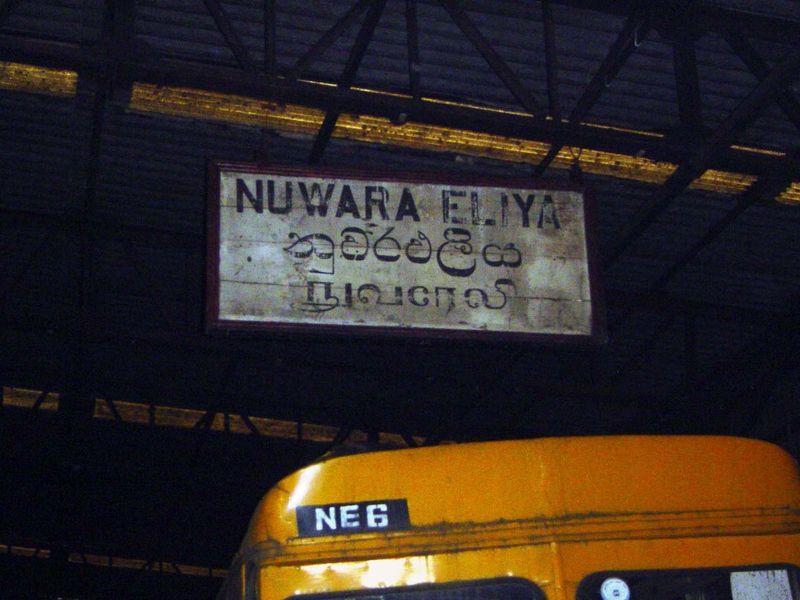Come around to the back of this Tudor-fronted building and you see a line of buses. The sign, however, puts English first, which suggests a 