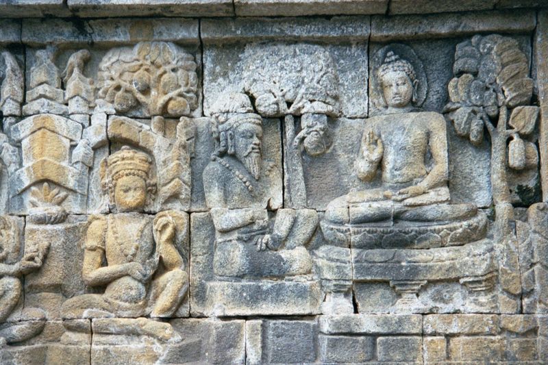 The prince has been studying with Arada Kalapa, a Brahman. Now, however, he himself has become a teacher. He is handed water by a student wh