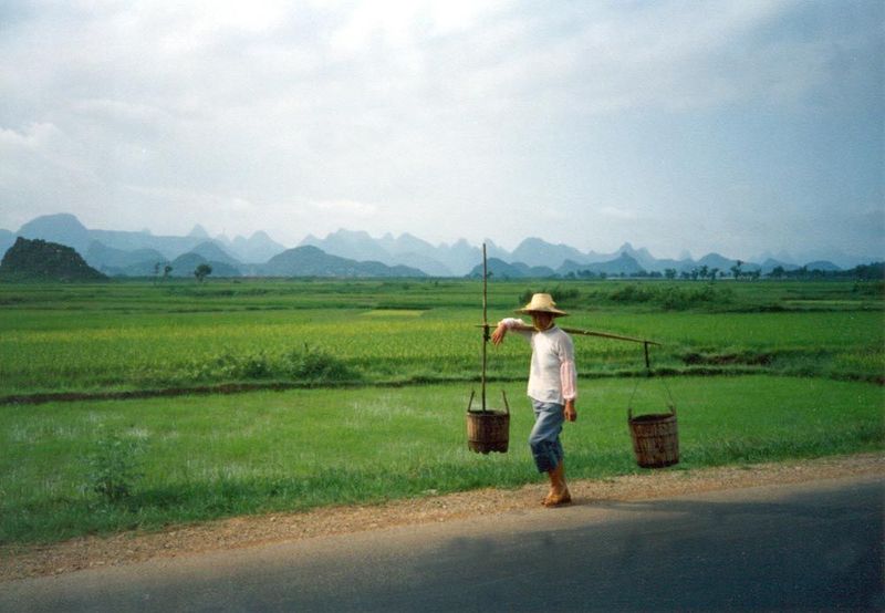 Plenty of people stay busy with ancient tasks, such as distributing buckets of human waste caught in latrines and carried out to the fields.