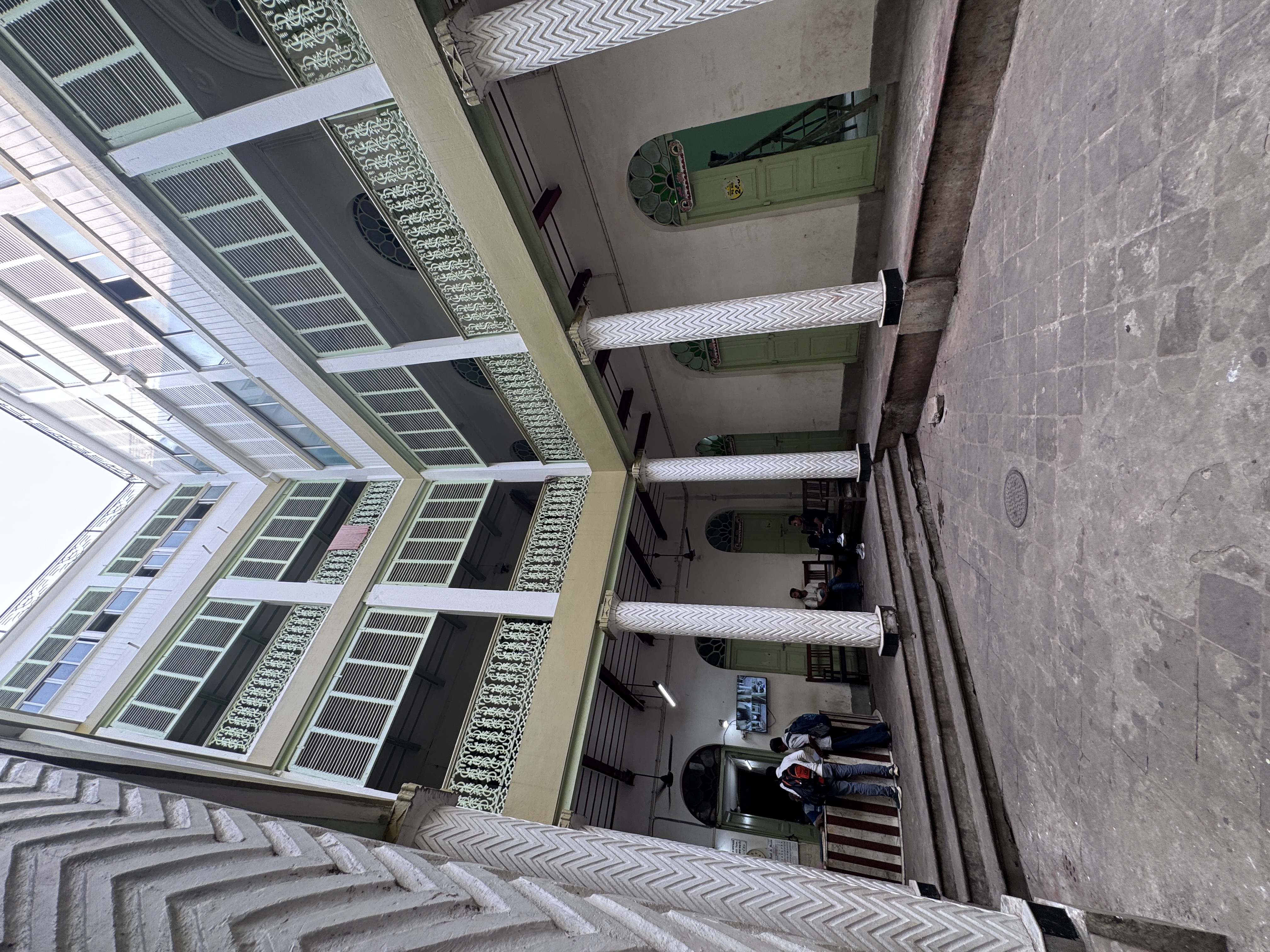 Beyond the archway lies the modernized lodge quarters.  No iron filigree here.