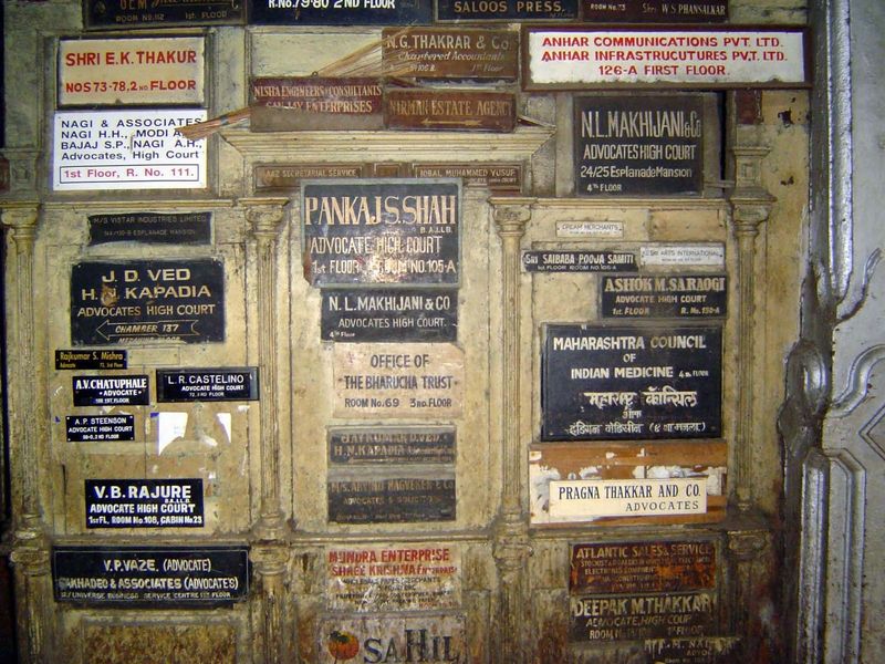 Signboards for the building's present tenants.