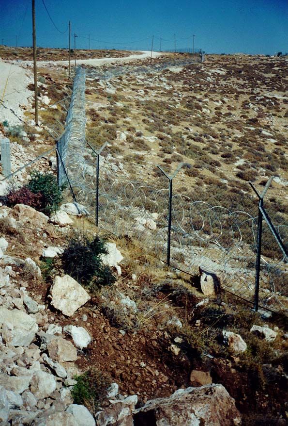 Metzad again. The fencing is impressive but atypical. Most West Bank settlements are now so old that the original chain-link fencing, though