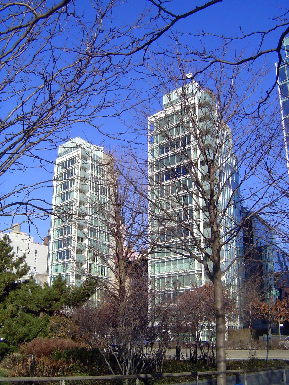 Richard Meier designed this pair of apartment buildings at Perry Street near Pier 49. Completed in 2002, the buildings offer a single apartm