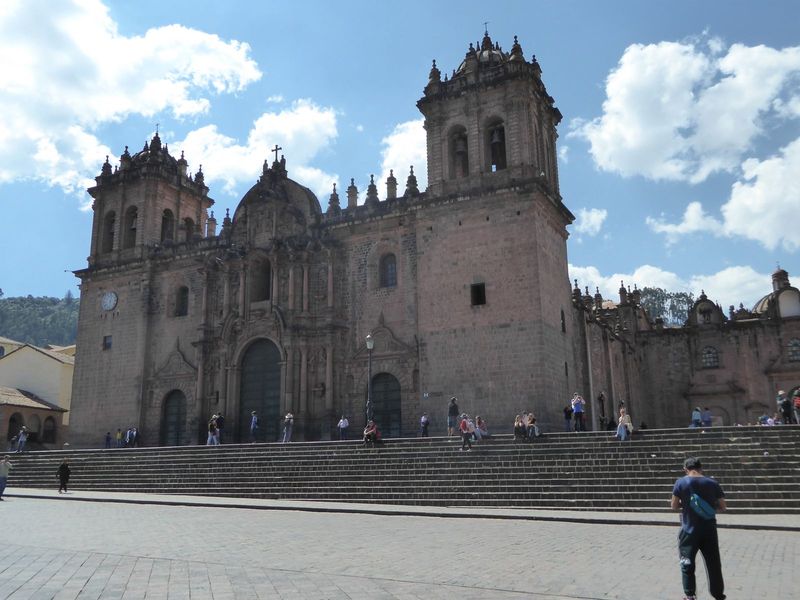 The cathedral is flanked by two smaller churches. On the right here, cut off, is the Triunfo or "Triumph," the first church in town and open
