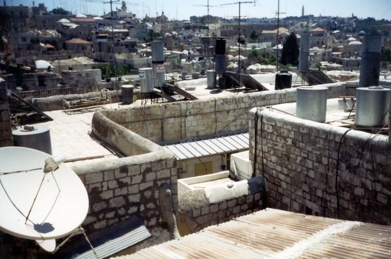The Muslim Quarter is the poorest part of the city; even so, rooftops have tanks, solar panels, and satellite dishes.