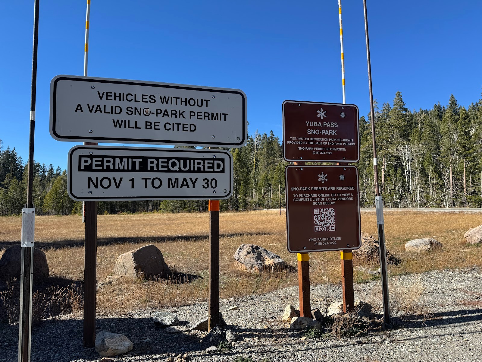 Yuba Pass, 12 miles past Sierra City, is a letdown after the Buttes.  Worse than that: look at those signs, demanding a permit to park.