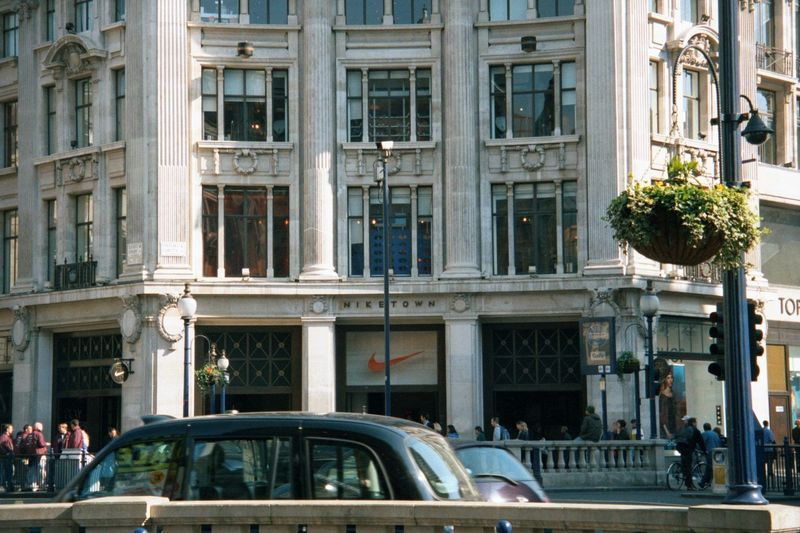 The four nearly identical buildings at this intersection of London's two busiest shopping streets were finished by Henry Tanner in or after 