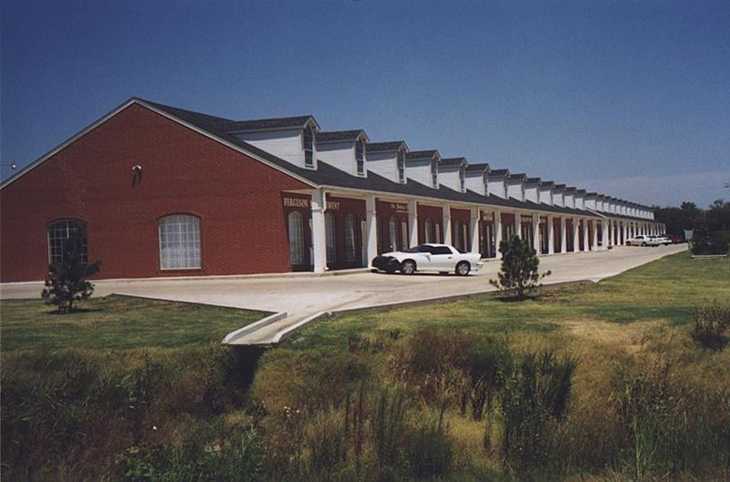 Three or four miles north on Interstate 35 is this delightful line of freeway-side shops. Note the fine drainage. It is reported that George