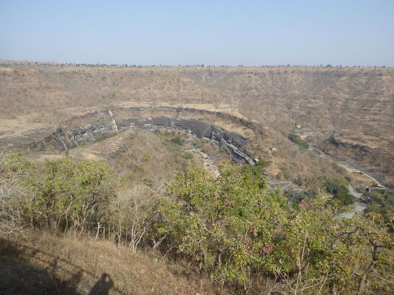 The sinuous Waghora, or "Tiger," River threads its course through old basalt flows. The caves at Ajanta from a Sanskrit word meaning "impreg