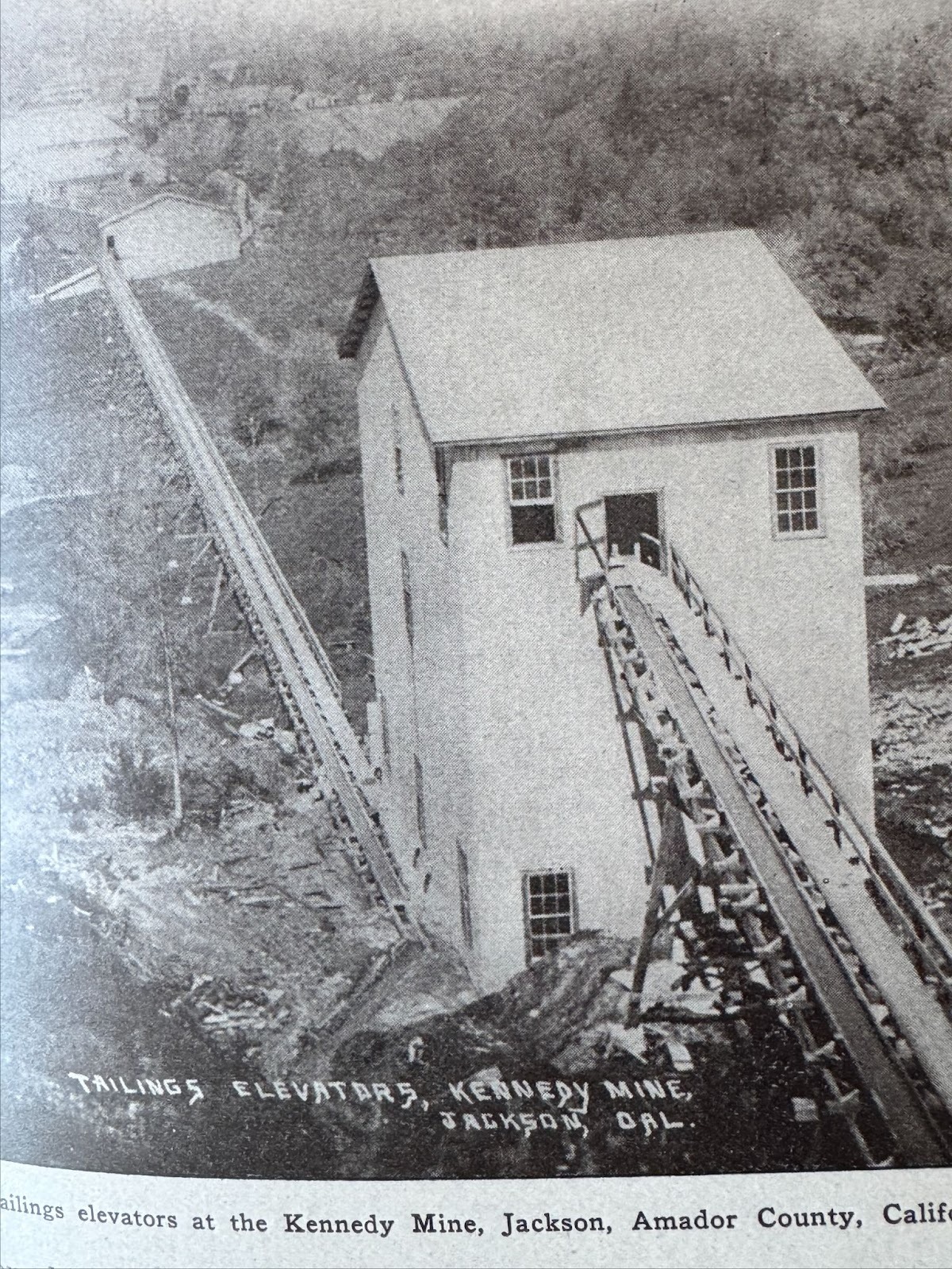 Close up of the series of elevators that carried a slurry of mill waste to a distant pond.  What was inside those elevator buildings?

W.B. 