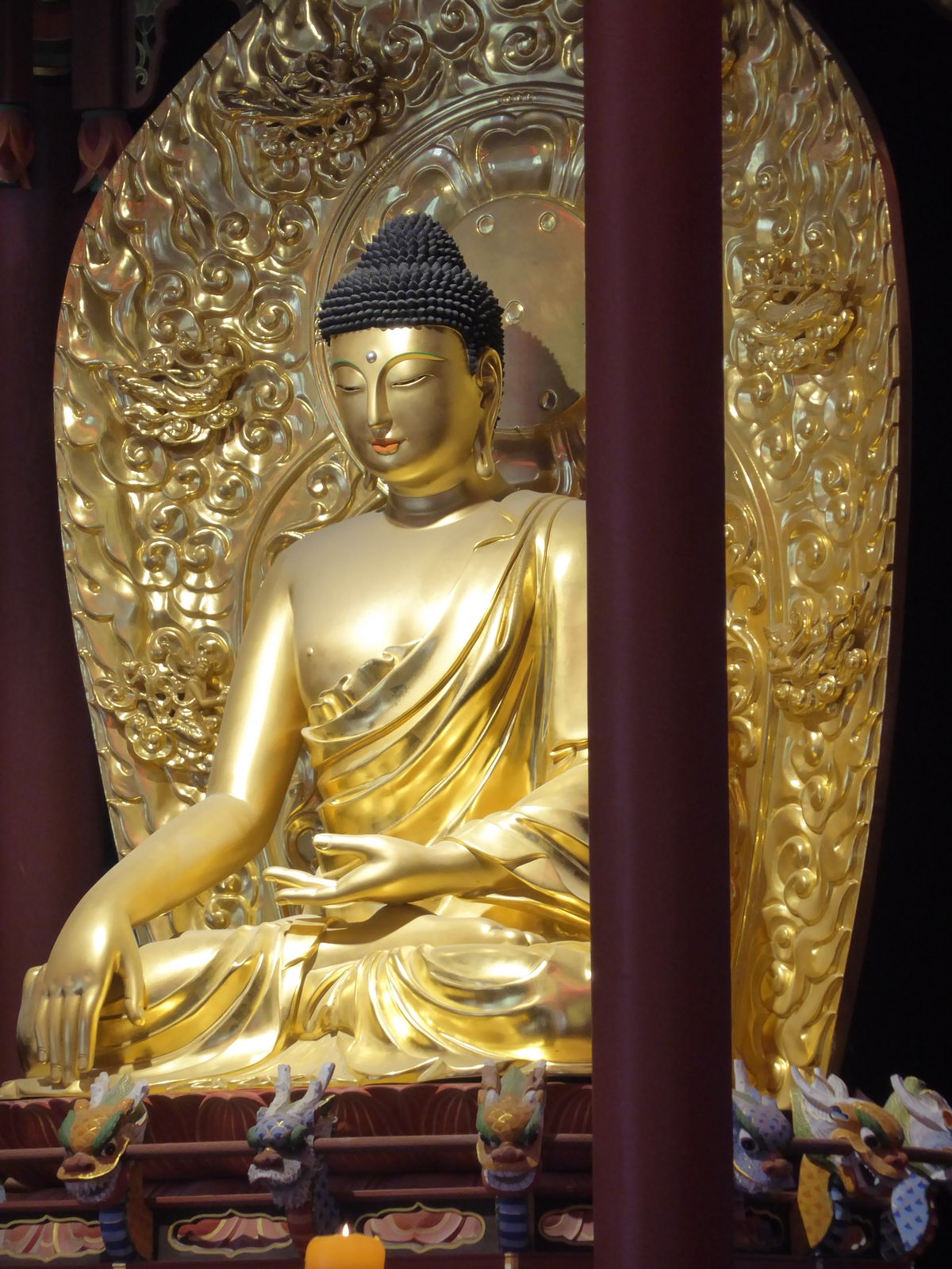 It can't be very old, either. The stylized position is the mudra called Bhumisparsa, the moment of enlightenment.