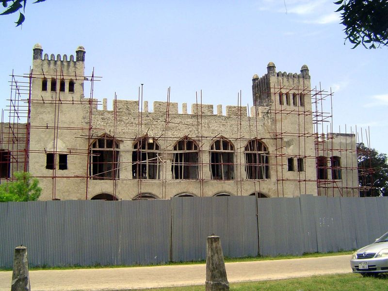 Nearby, obscured by renovation works, is the old Boma, or German administration building.
