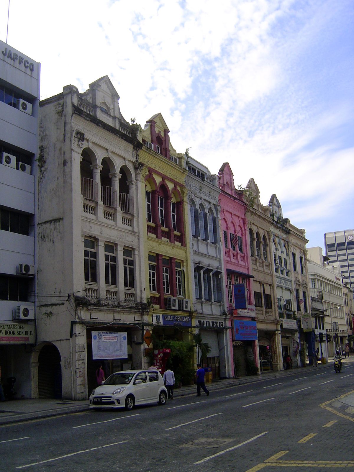 Old shophouses on the Old Market Square, Lebuh Pasar, get some paint.