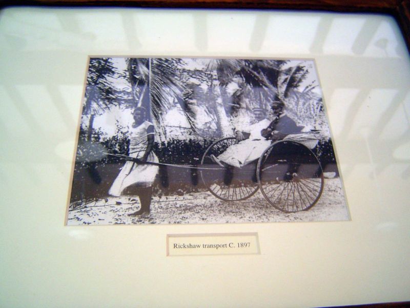 On the wall of the post office turned hotel, there's a remarkable sight: a rickshaw pulled by a woman.